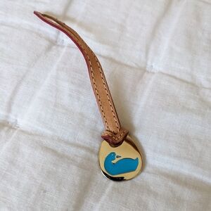 Dooney & Bourke gold duck keychain, leather strap